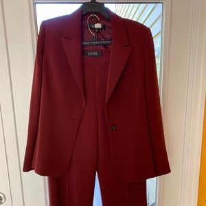 A red/ burgundy pants suit
